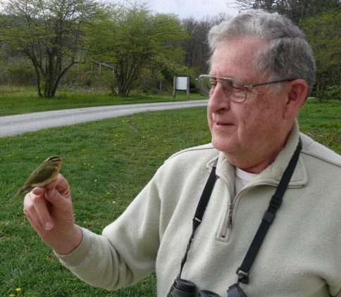 Bob Leberman holding Worm-eating Warbler