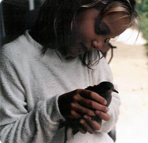 Same woman as a child, also holding a Mourning Dove