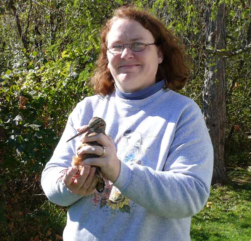 Woman holding American Woodcock