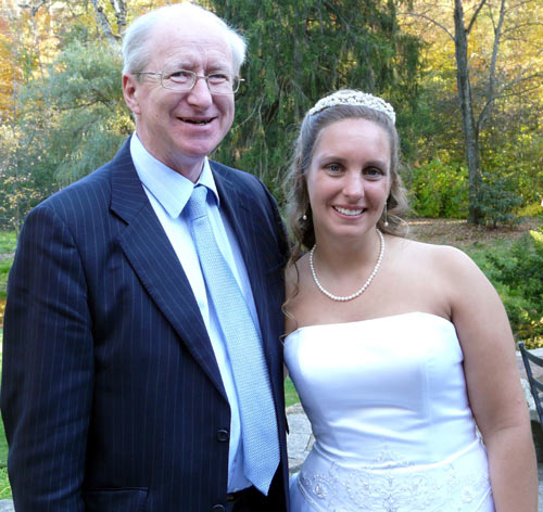 Older man in a suit and woman in a bridal gown