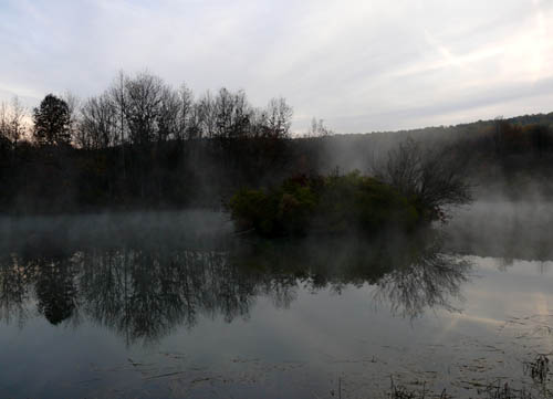 pond in the early morning with fog